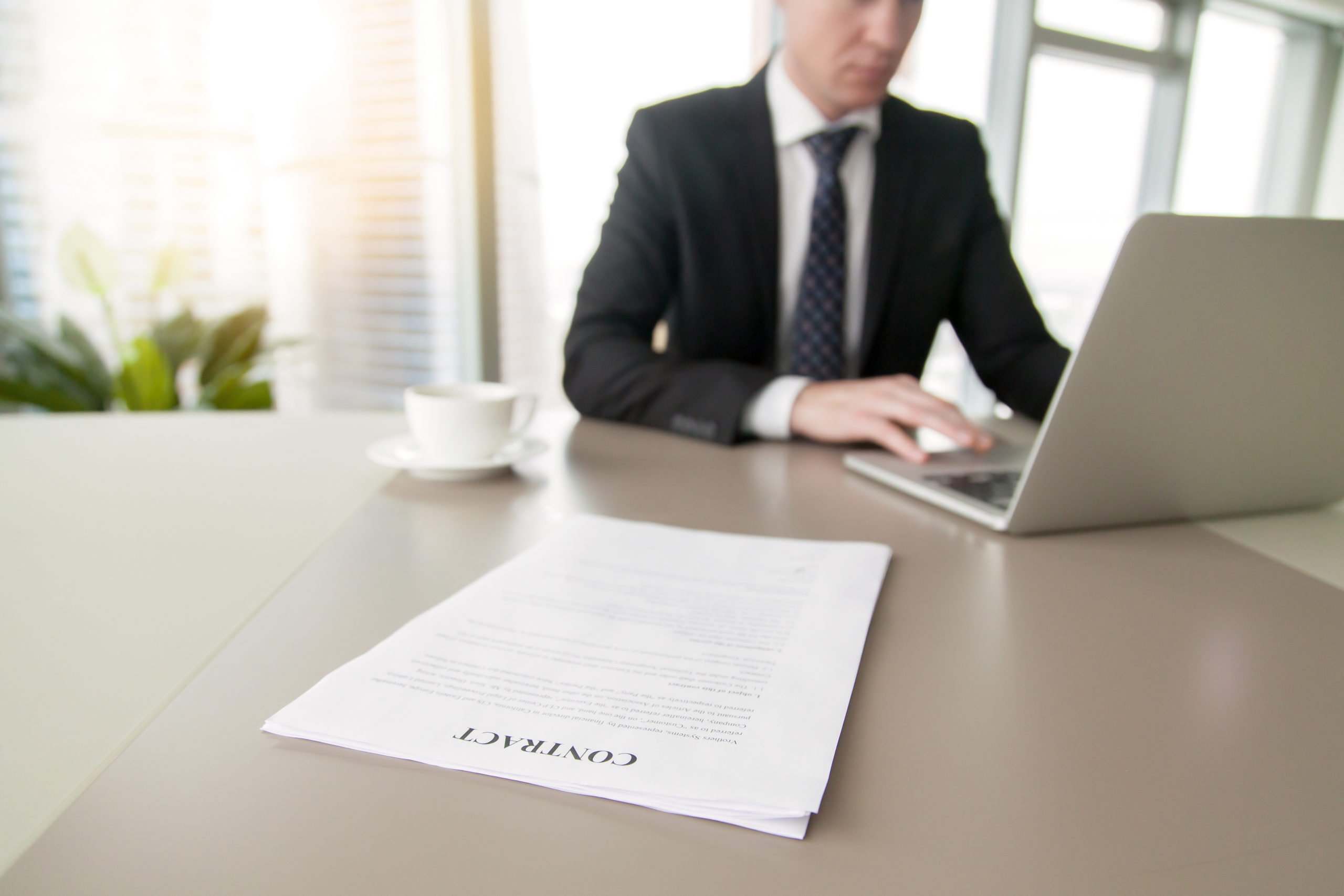 Close up of a contract on the office desk, mutual promises, or obligations, between the parties making the agreement, signing an employment contract, negotiated an important agreement